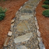 Mohave flagstone and Tennessee river gravel path bordered with Tennessee medium stack fieldstone