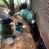 Team applying waterproofing