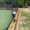 Grading and drainage around a tennis court