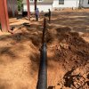 Drainage lines to get water from gutter away from foundation