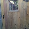 Custom gate with wood privacy fencing