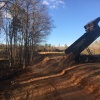 Our dump truck delivering soil for grading