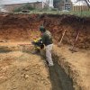 Compacting the material for the retaining wall 
