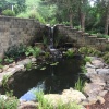 Retaining wall with waterfall into pond
