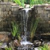 Retaining wall with waterfall into pond