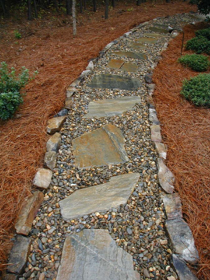 Mohave flagstone and Tennessee river gravel path bordered with Tennessee medium stack fieldstone