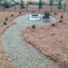 Pea gravel walkway to stack stone fire pit