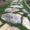 Natural stone walkway with Mondo grass