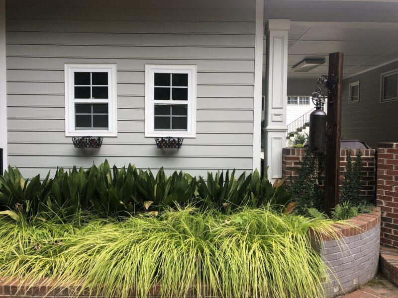 Brick retaining wall, landscape retainer wall, licensed plant selection, annual plants