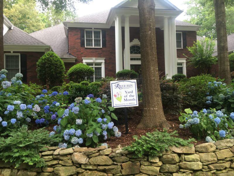 Yard of the Month Award, award winning landscaping, licensed plant selection, stone retaining wall