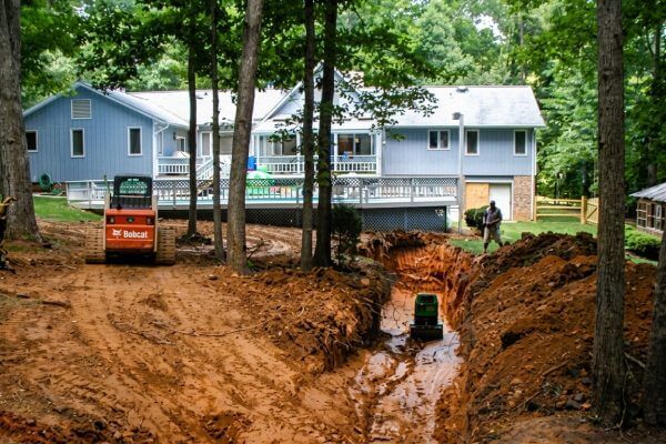 Engineered drainage solutions for backyard sinkhole issue