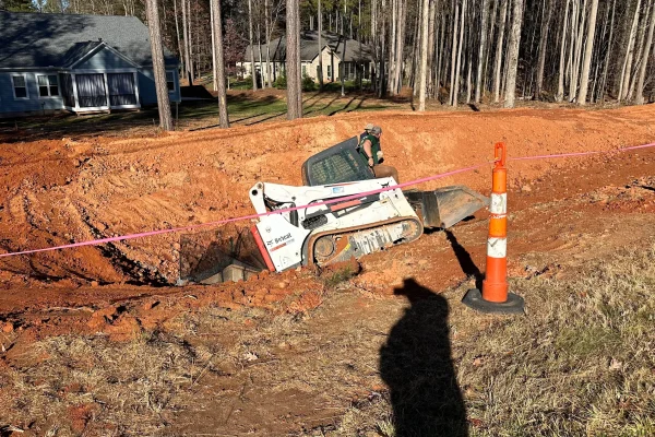 Outdoor Contracting began with a detailed site evaluation to identify why previous drainage solutions had failed.