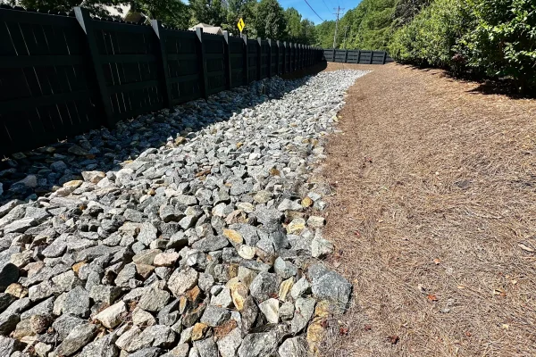 Corrective grading throughout the property established positive drainage and eliminated areas where water previously collected.