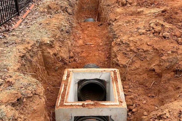 Years of contractor oversight left this property vulnerable to severe erosion, standing water, and potential flooding during heavy rain events.