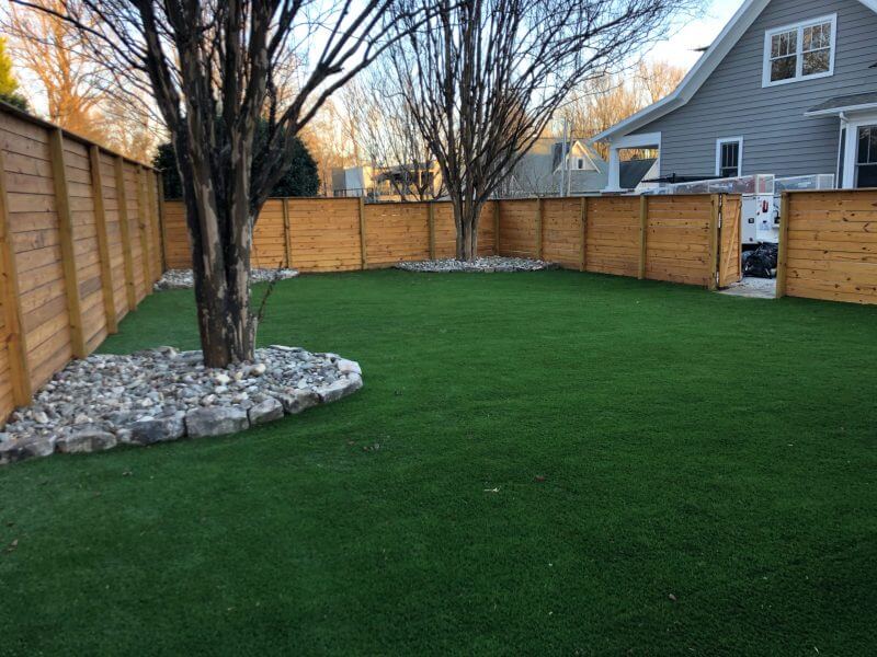 wooden privacy fence, artificial turf